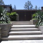 Modern Stone Landscape with Dark Door