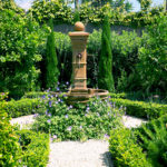 Water Feature Surrounded By Florals